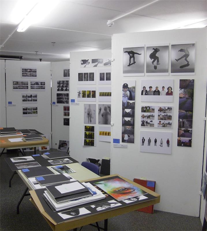 Students' art work displayed on boards and tables ready for moderation