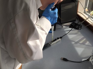 Student loading the MinION DNA sequencer in the classroom