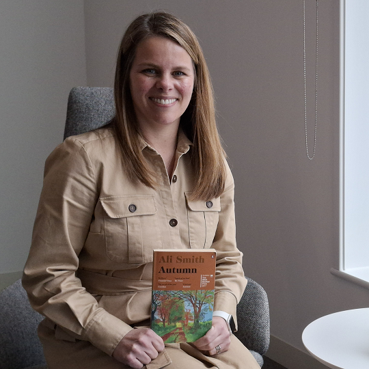 Nicola, holding her book recommendation, Autumn