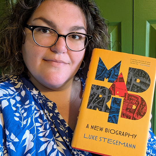 Sam, holding her book recommendation, Madrid: A New Biography